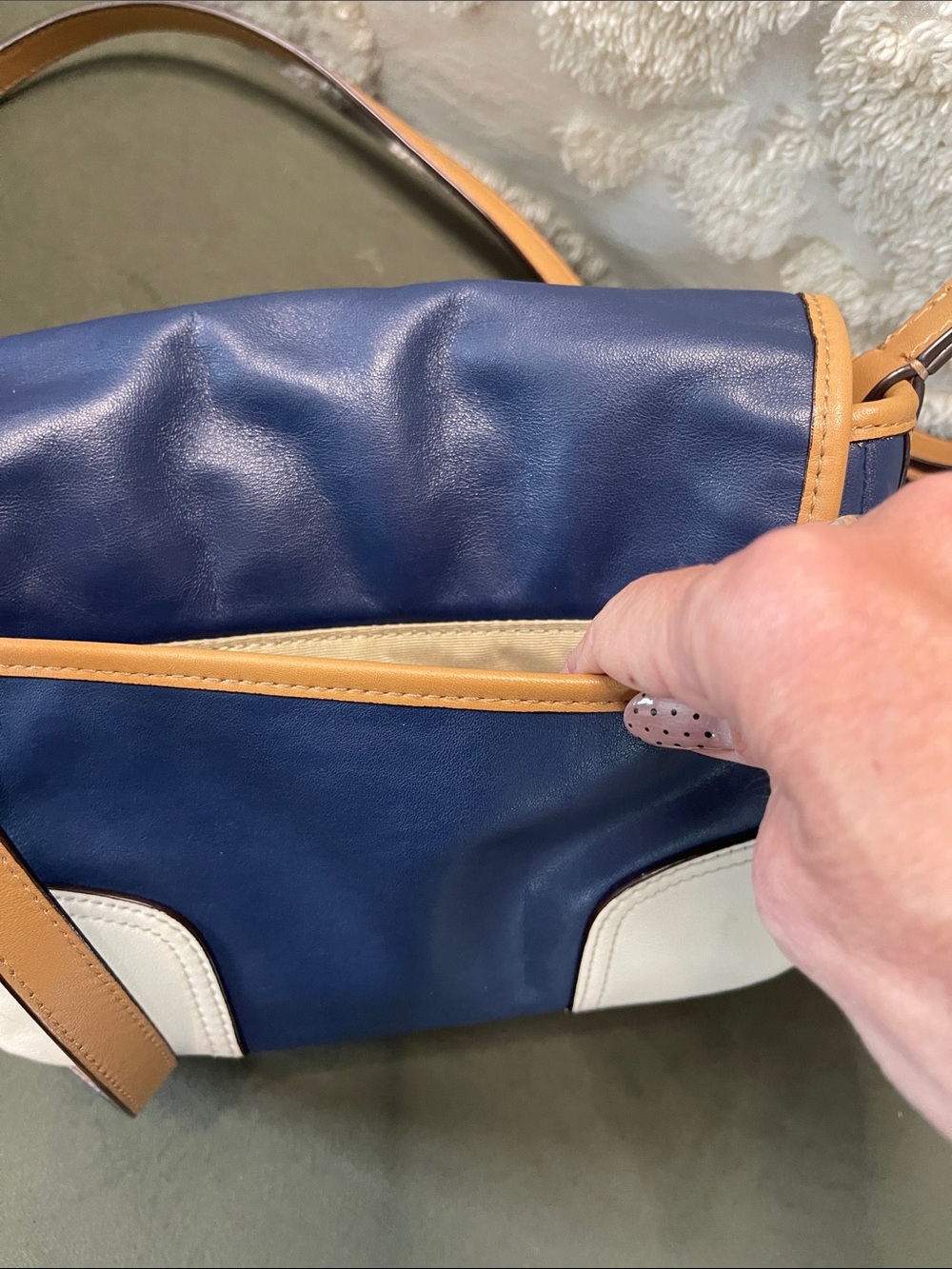 Coach Hadley leather crossbody bag in a navy, tan, and white colorblock design. - Picture 6 of 11